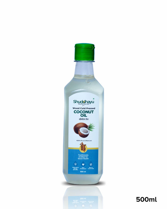 Shuddhayu coconut oil bottle with a green cap on a white background