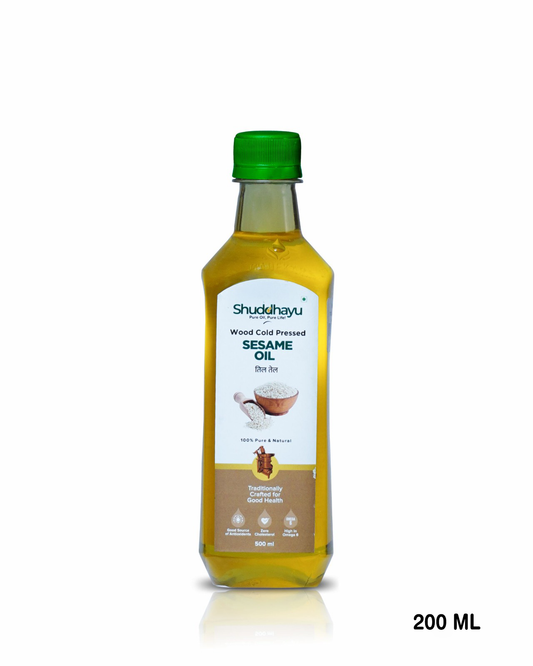 Bottle of Shudhavyu Sesame Oil with a green cap on a white background