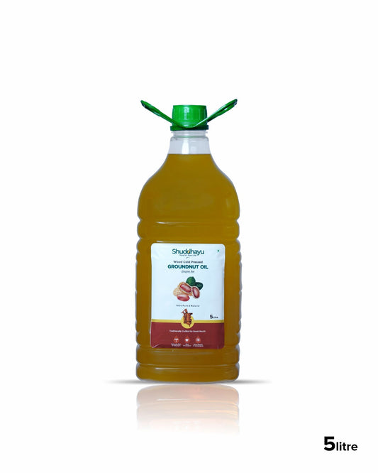Bottle of Shuddhayu Groundnut Oil with a green cap on a white background
